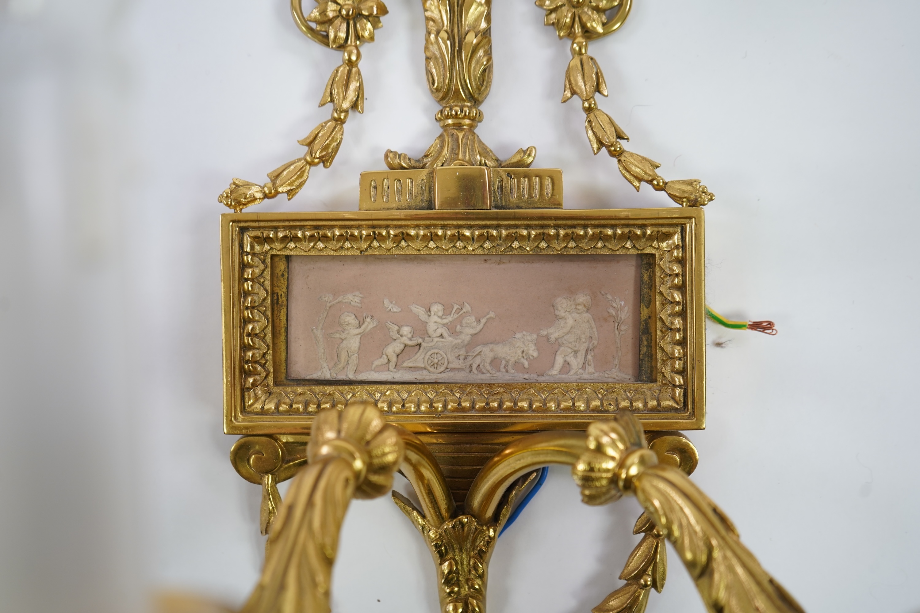 A set of four Adam style ormolu and jasper ware mounted wall appliques, early 20th century